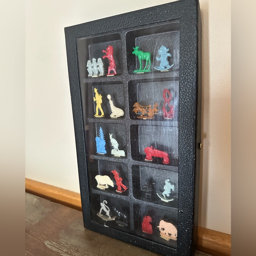 Vintage crackerjack prizes in collector case